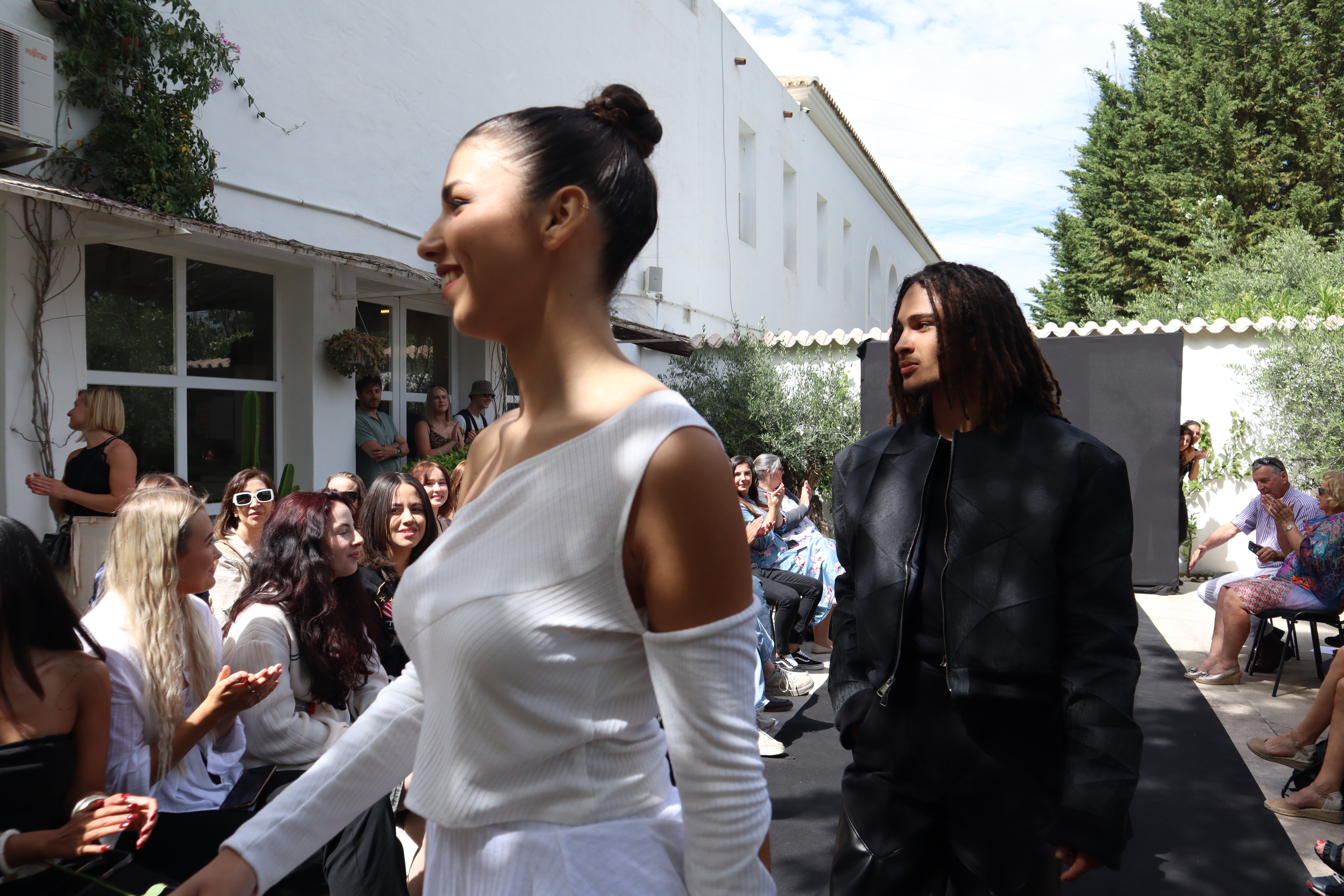 Models presenting Lorimer garments on an outdoor runway