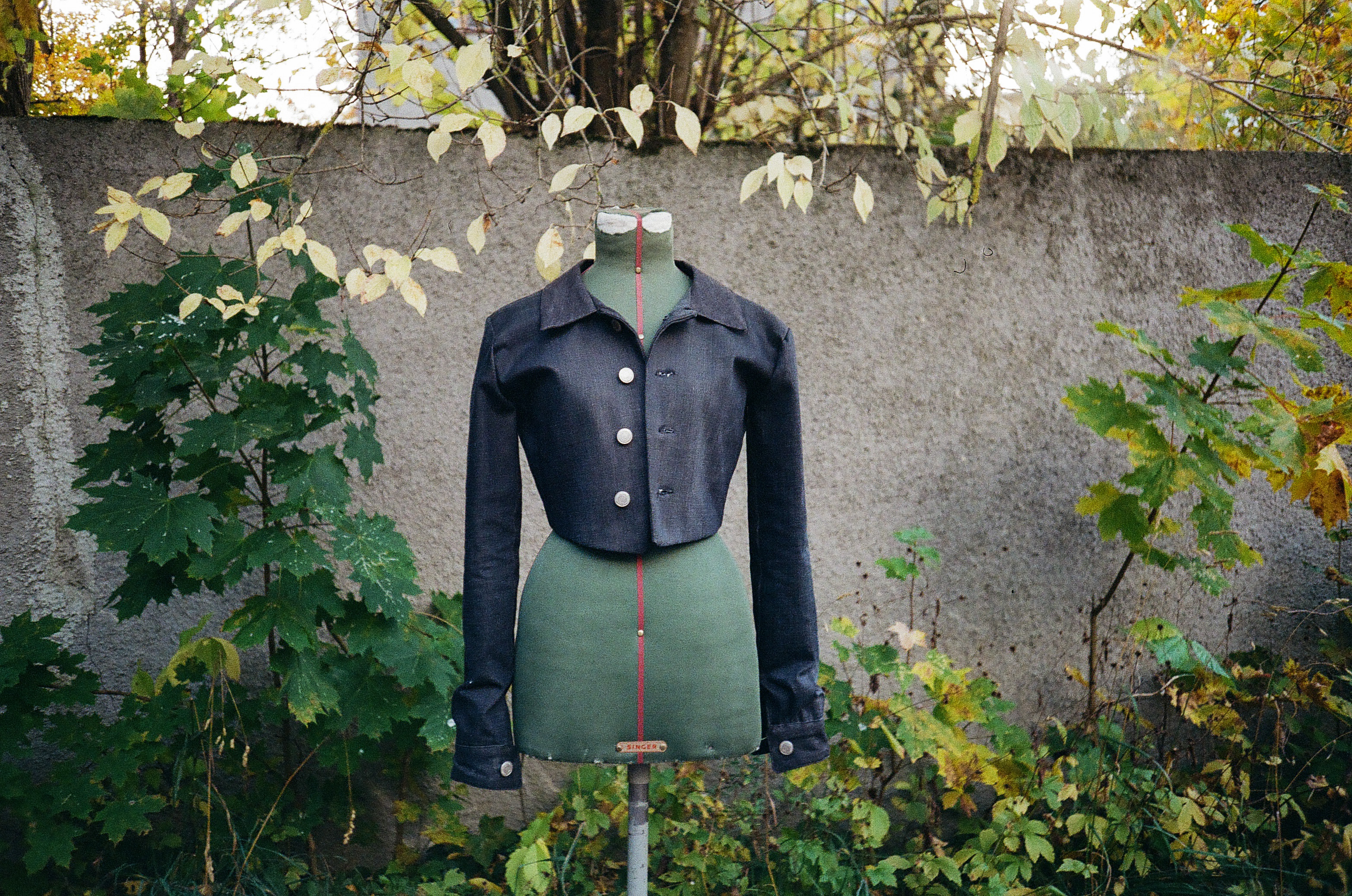Lorimer jacket displayed on a dress form outdoors